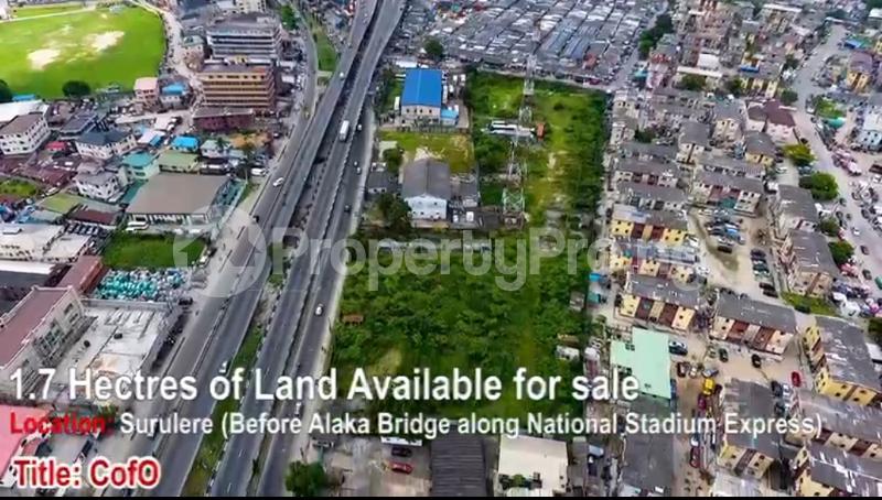 Land for sale Before Alaka Bridge Along Stadium Western Avenue Surulere Lagos - 0