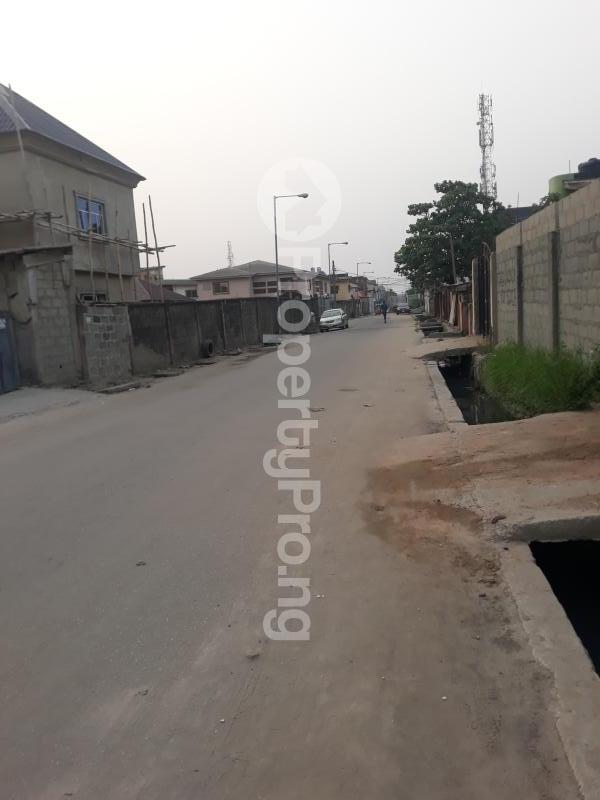 Land for sale Tarred Road,ago Palace Way Okota Ago palace Okota Lagos Realtors in Nigeria