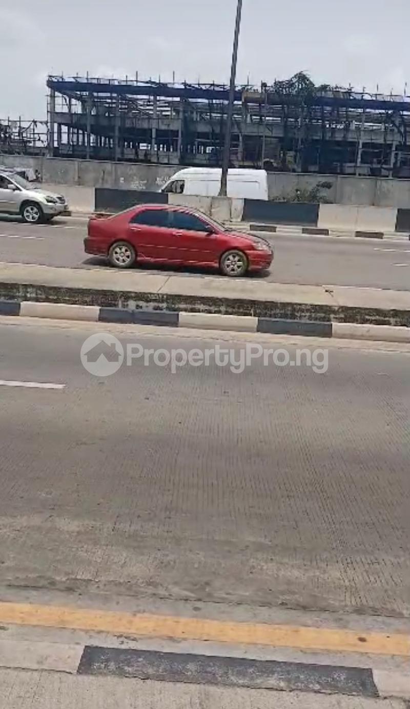 10 bedroom Land for sale @ (charity B/stop) Facing Directly Along Oshodi/apapa Expressway Oshodi Expressway Oshodi Lagos - 0